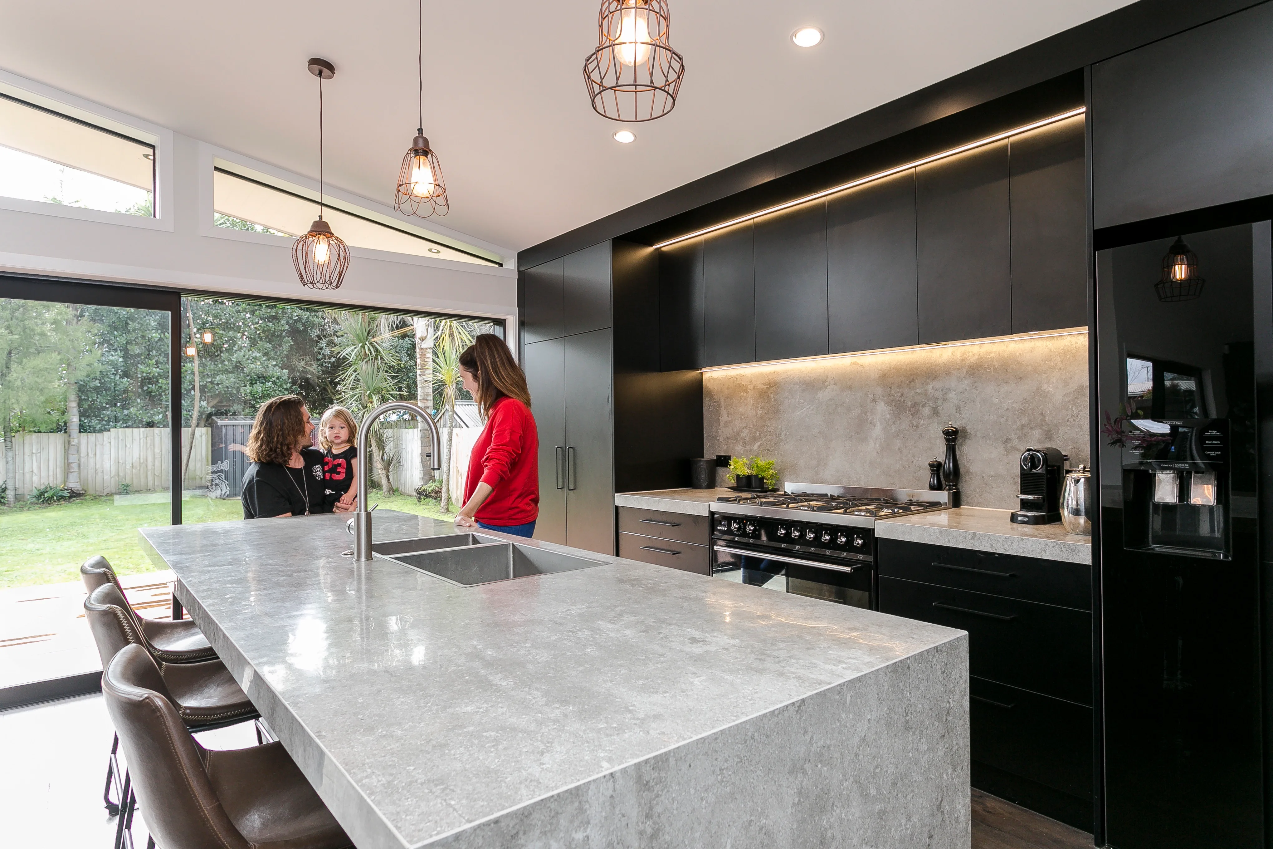 Hazelmere house – kitchen with white stone benchtop and black cabinetry