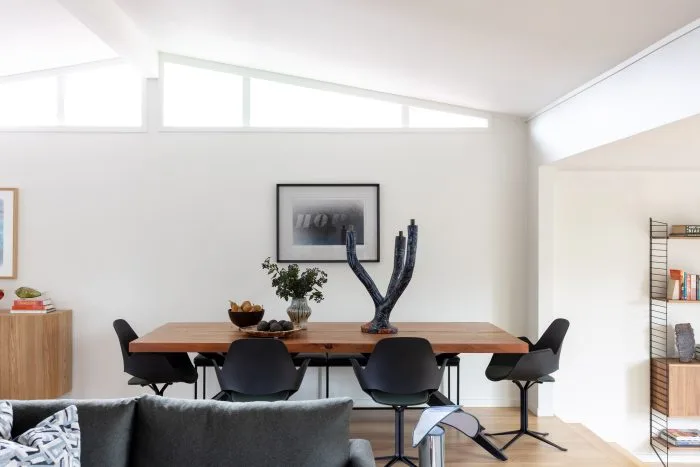 Deep Creek – dining room with clerestory windows, abstract artwork and sculptural candlesticks