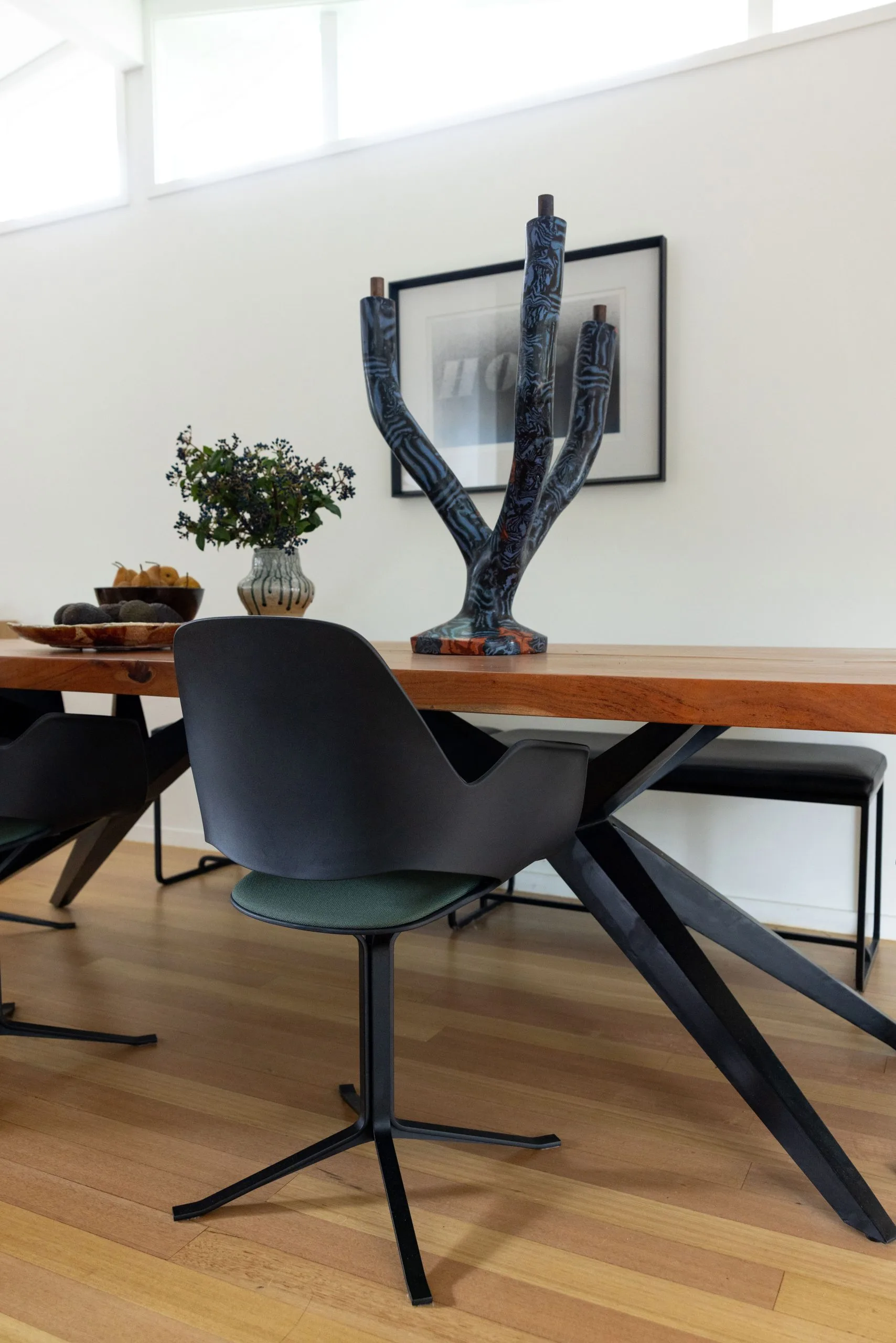 Deep Creek – sideboard styled with fresh flowers and sculptural objects, artwork above