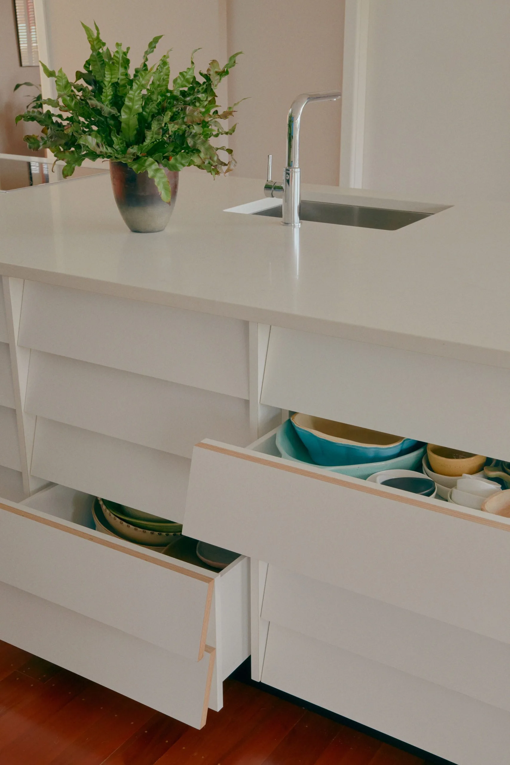 Kitenui Kitchen – detail of island drawers with crockery storage, tap and sink
